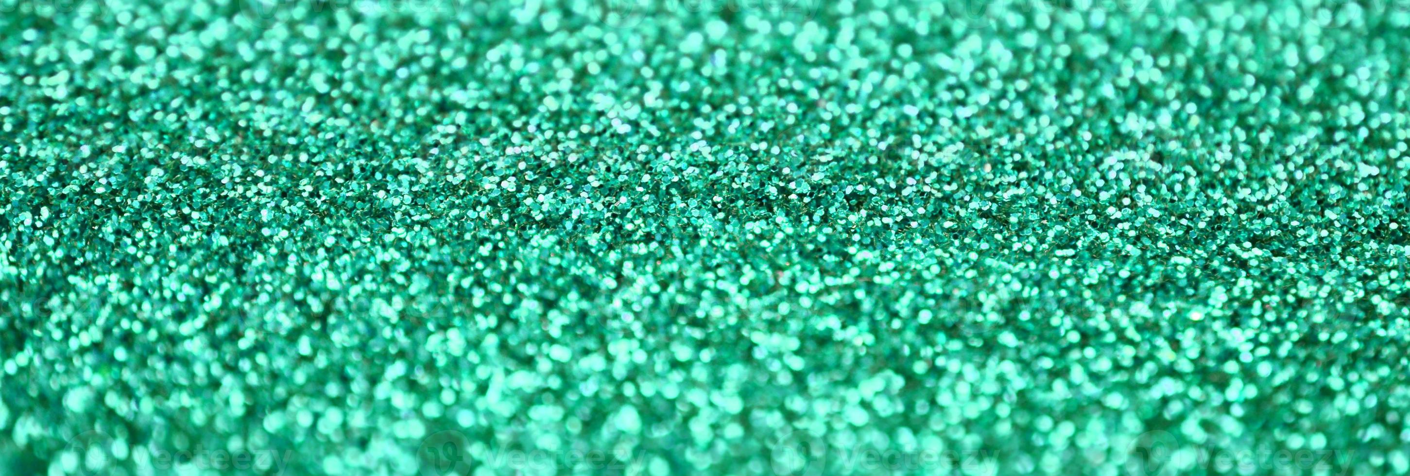 A huge amount of decorative sequins. Background image with shiny bokeh lights from small elements photo