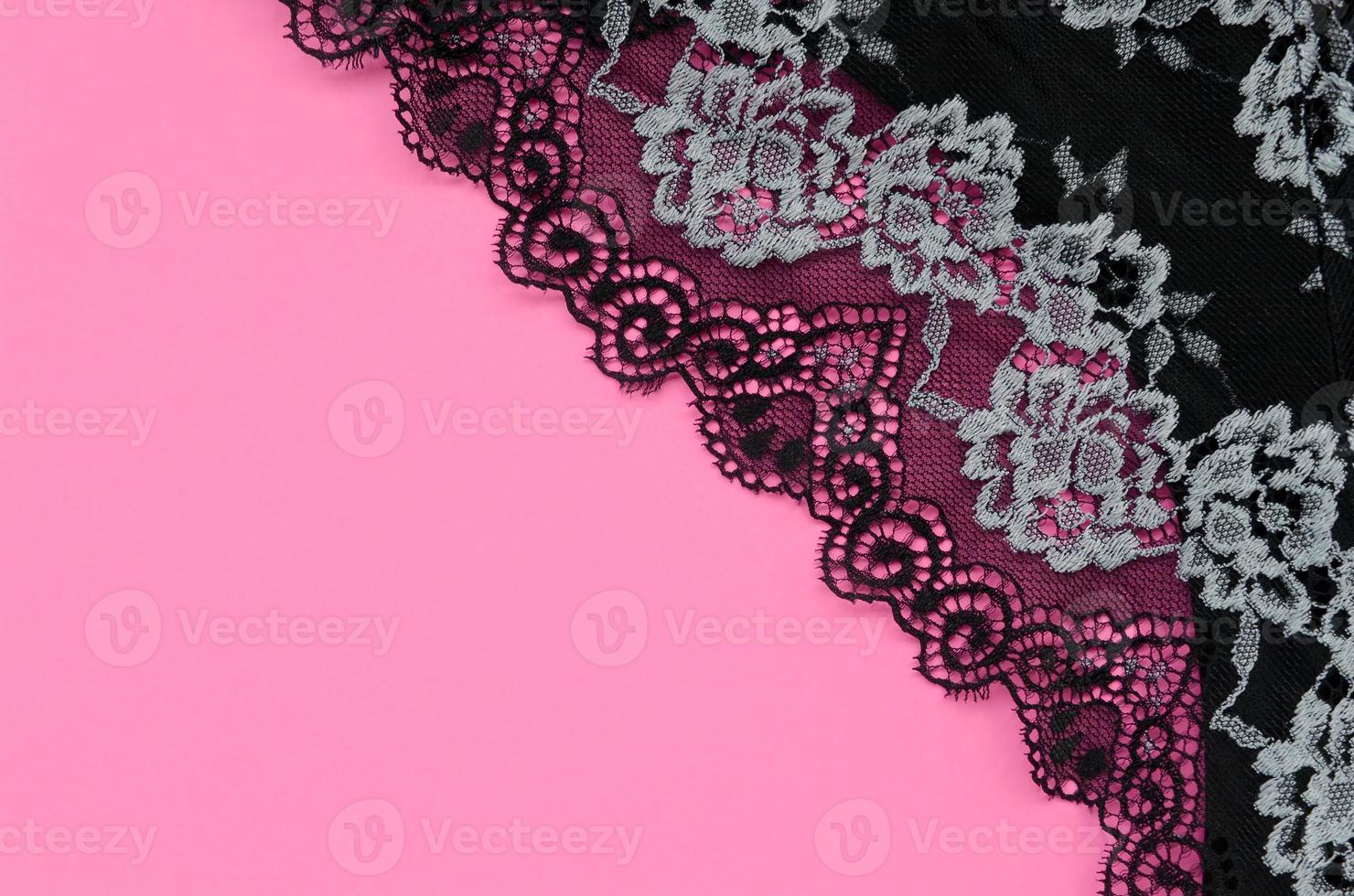 Black women underwear with lace on pink background with copy space. Beauty fashion blogger concept. Romantic lingerie for Valentines day temptation photo