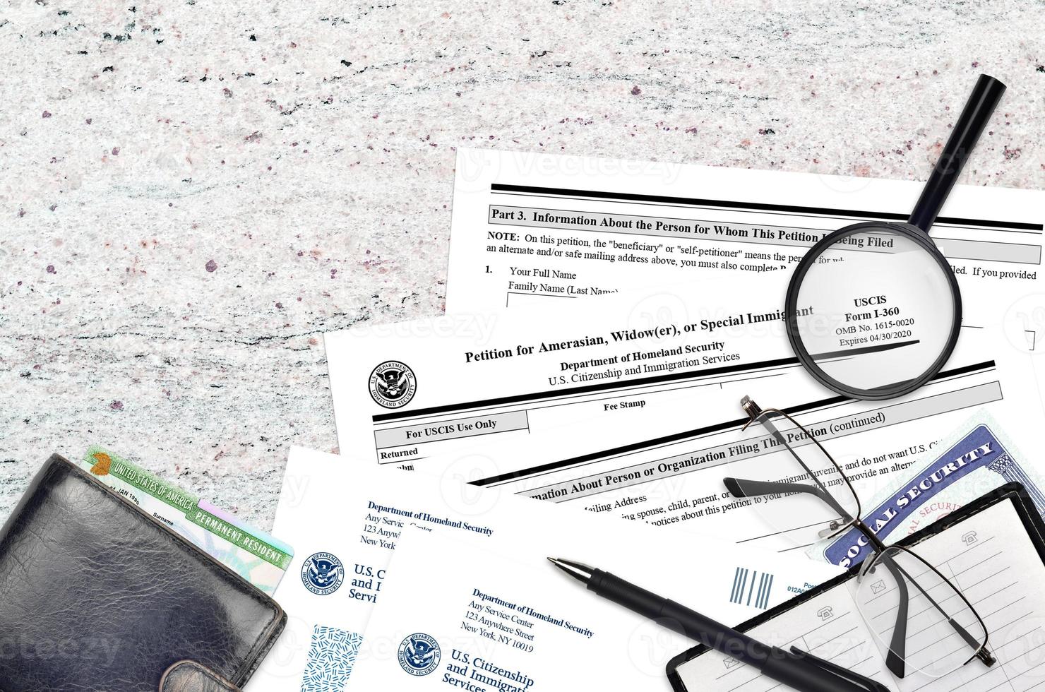 USCIS form I-360 Petition for amerasian, widower or special immigrant lies on flat lay office table and ready to fill. U.S. Citizenship and Immigration services paperwork concept photo