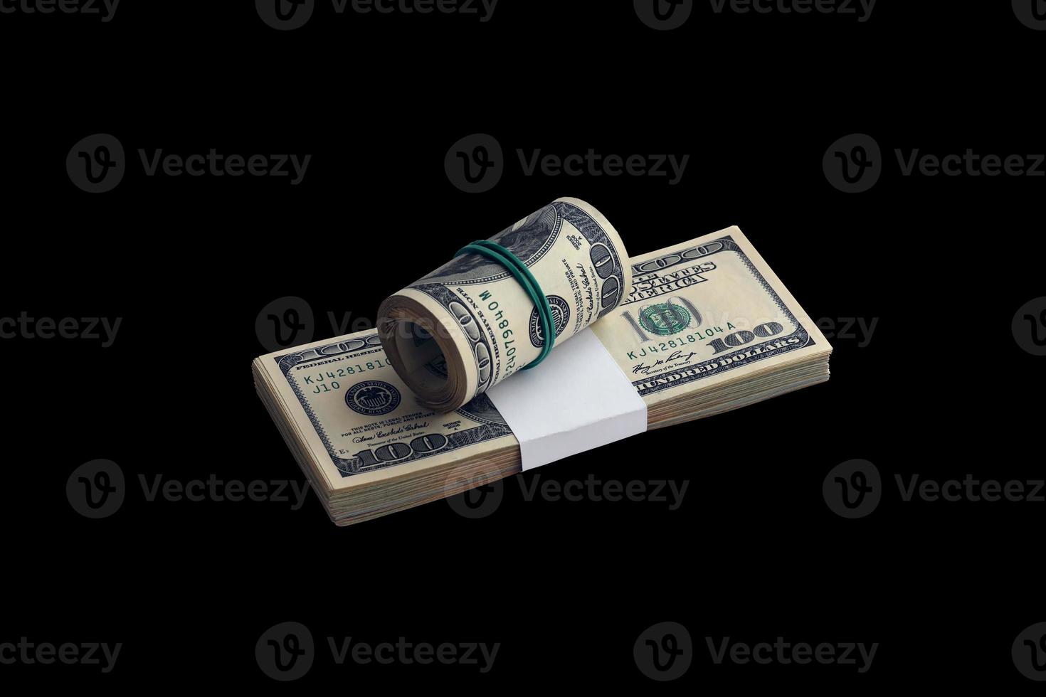Bundle of US dollar bills isolated on black. Pack of american money with high resolution on perfect black background photo