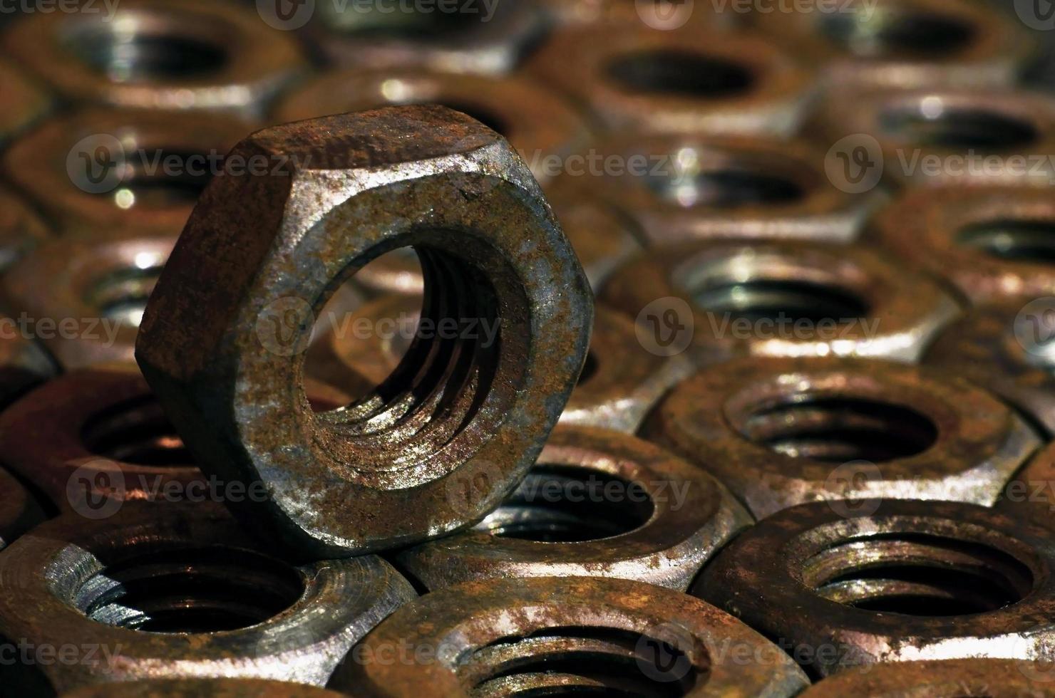 Close-up of rusty nuts photo