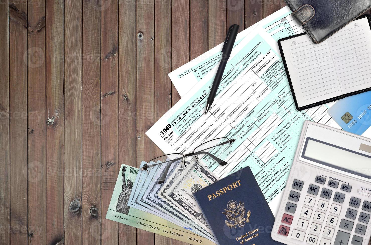 IRS form 1040 U.S. Individual income tax return with refund check lies on flat lay office table and ready to fill. U.S. Internal revenue services paperwork concept photo