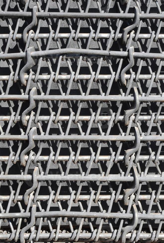 Metal multilayered thick grid of black color. Composite texture photo