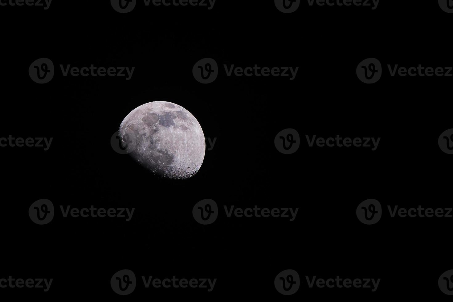 Waxing gibbous moon at night on a May evening in the northern hemisphere photo