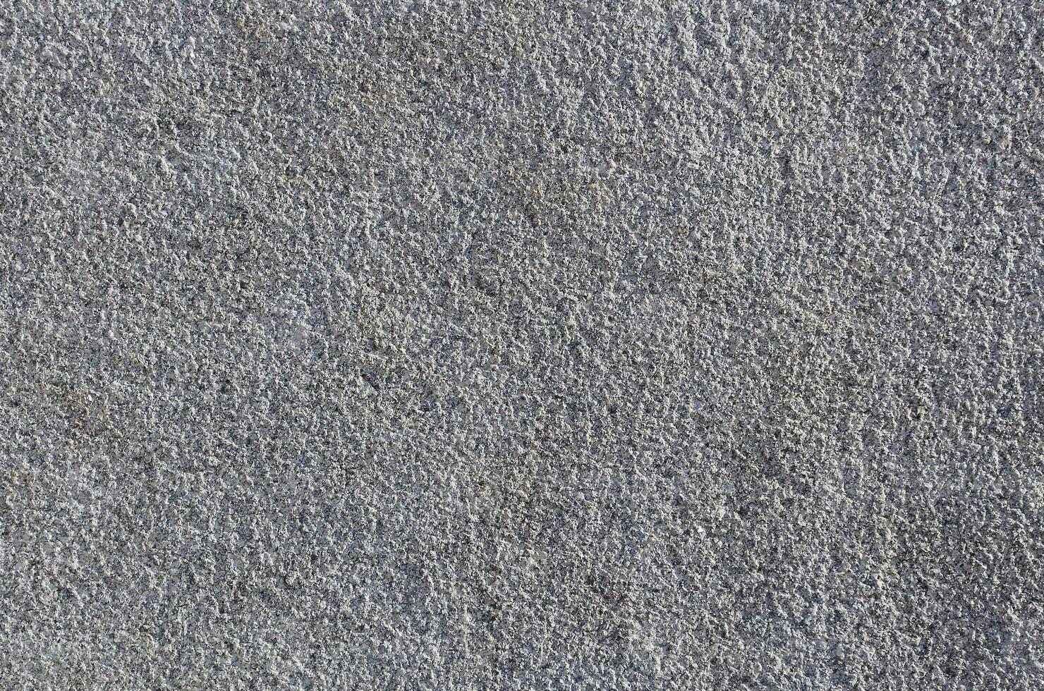 Texture of rough concrete wall with embossed texture photo