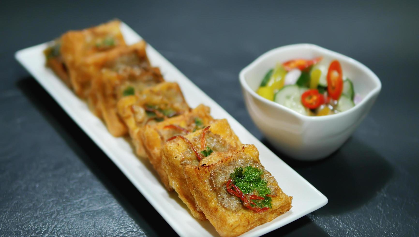 Deep Fried Minced Pork Toast, toast dip vegetable coriander and pork spread on top, Thai Chinese cookery nutrition food for restaurant and home kitchen photo