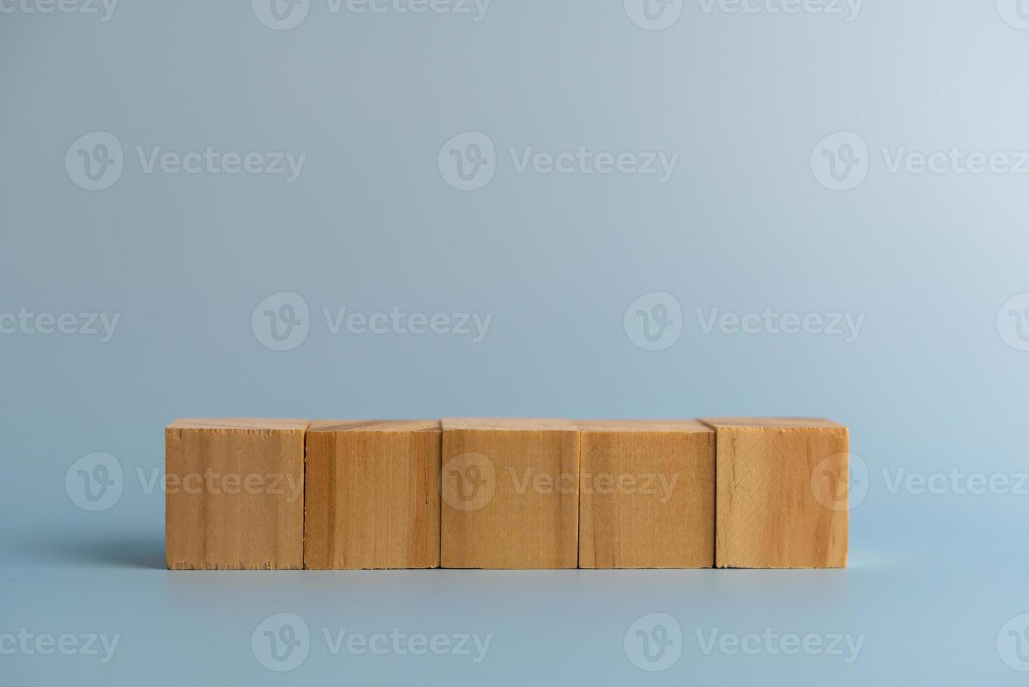 Five blank wooden block cubes on background for your text. Business concept template and banner. photo