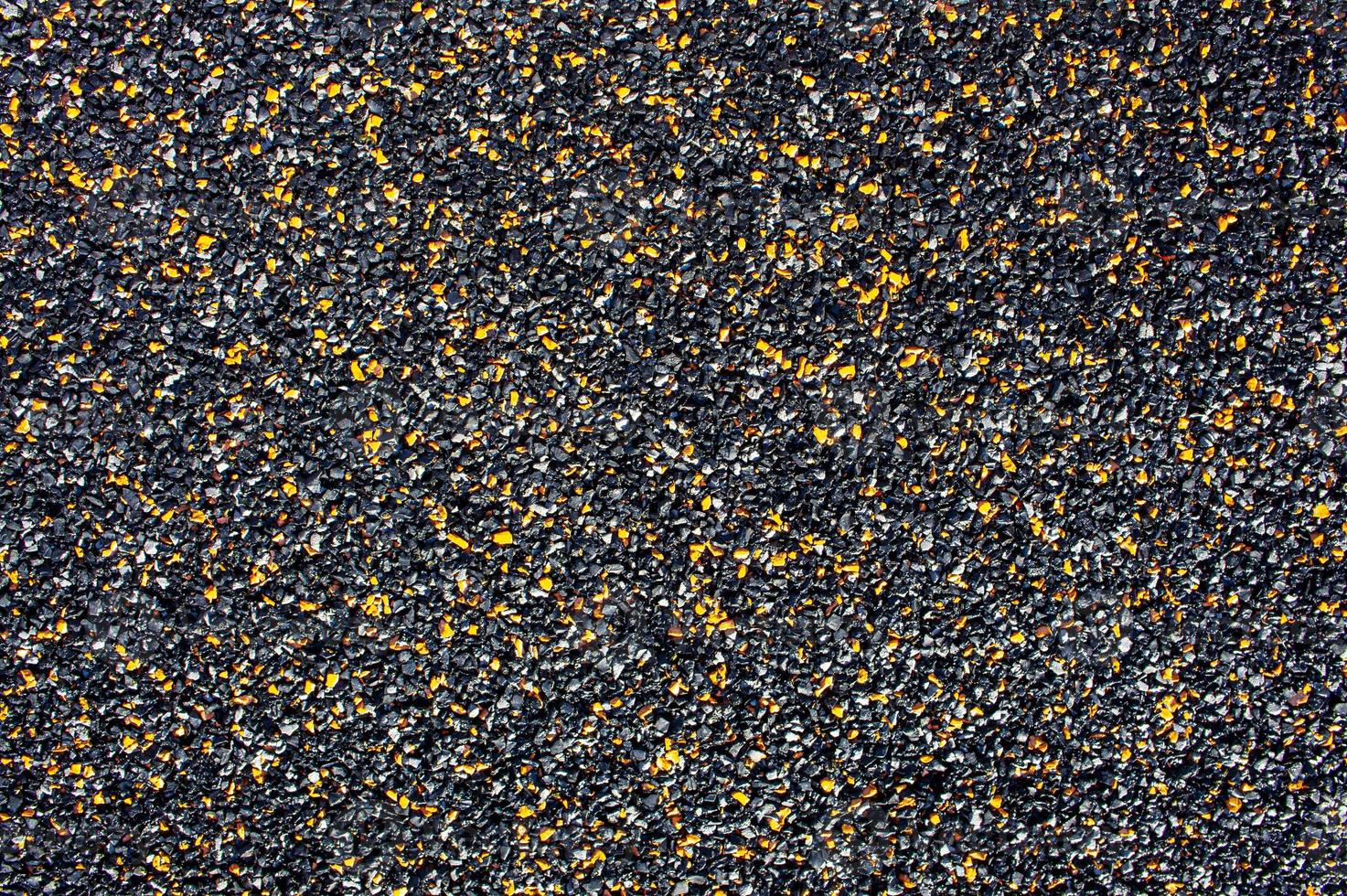 Background from small stone chips of black and orange colors photo