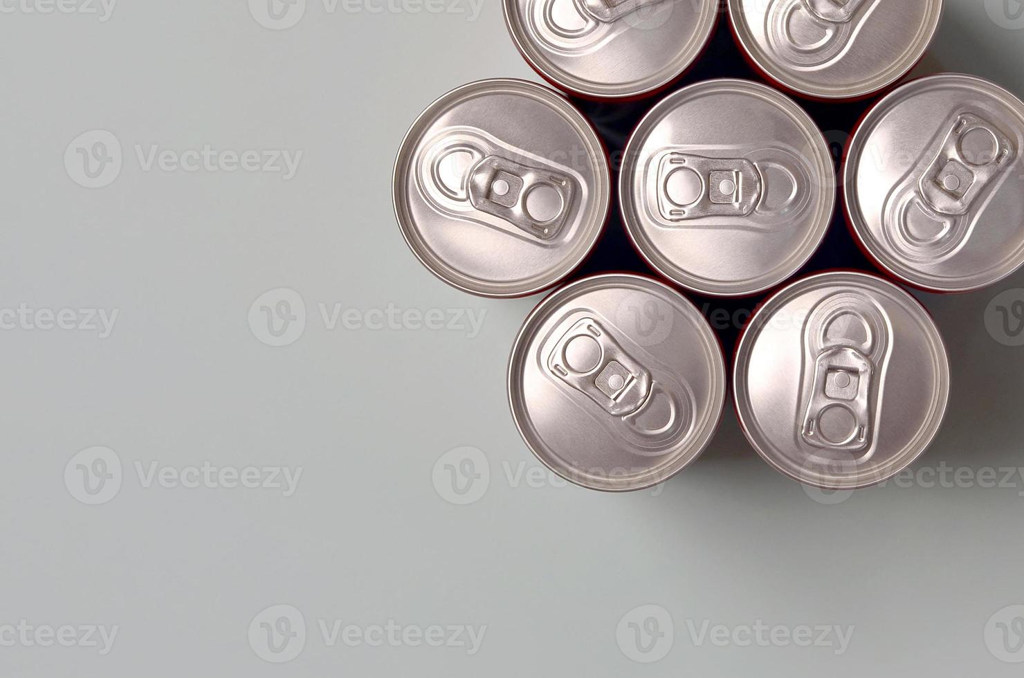 Many new aluminium cans of soda soft drink or energy drink containers. Drinks manufacturing concept and mass production photo