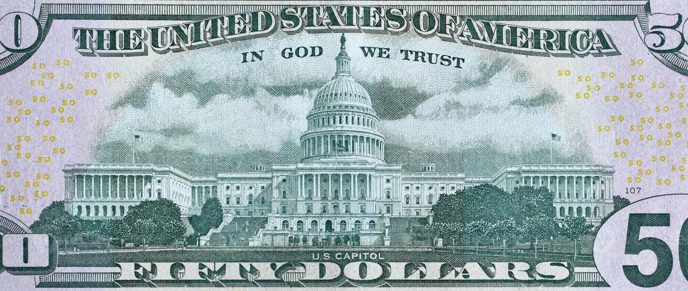 US Capitol on 50 dollars banknote back side closeup macro fragment. United states fifty dollars money bill photo