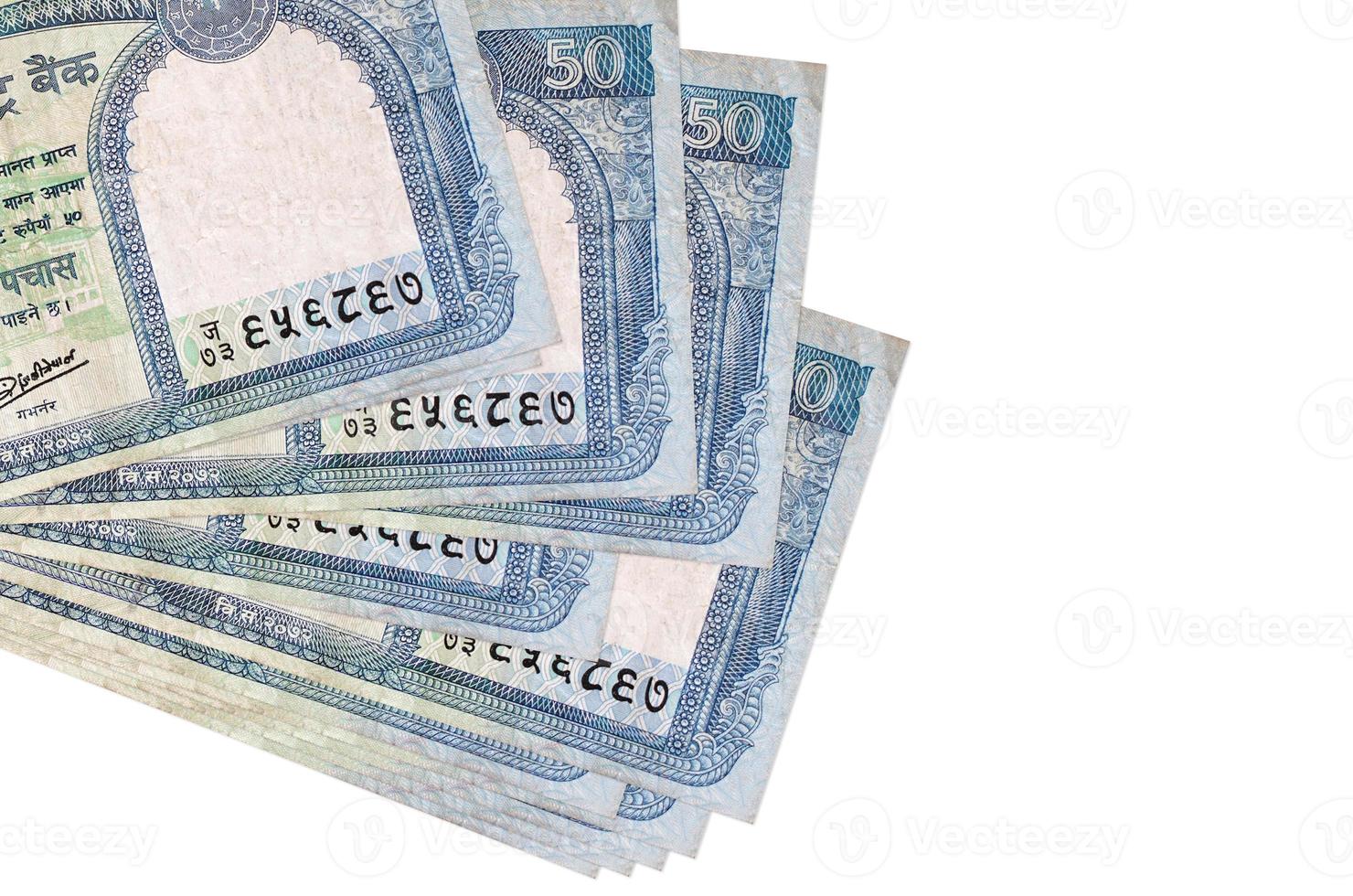 50 Nepalese rupees bills lies in small bunch or pack isolated on white. Mockup with copy space. Business and currency exchange photo