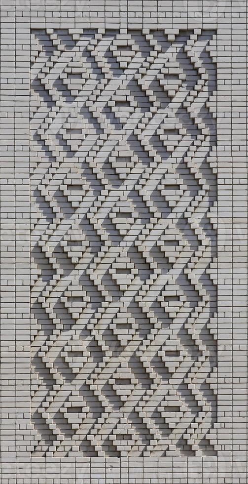 A pattern made of white bricks in the form of diamond shapes. Decoration of the walls during the Soviet Union photo