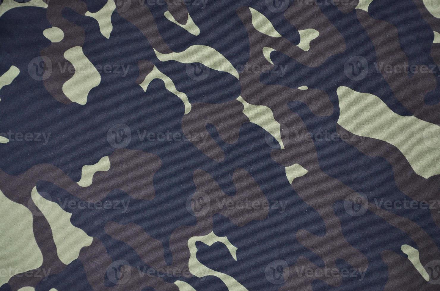 Textile pattern of military camouflage fabric photo