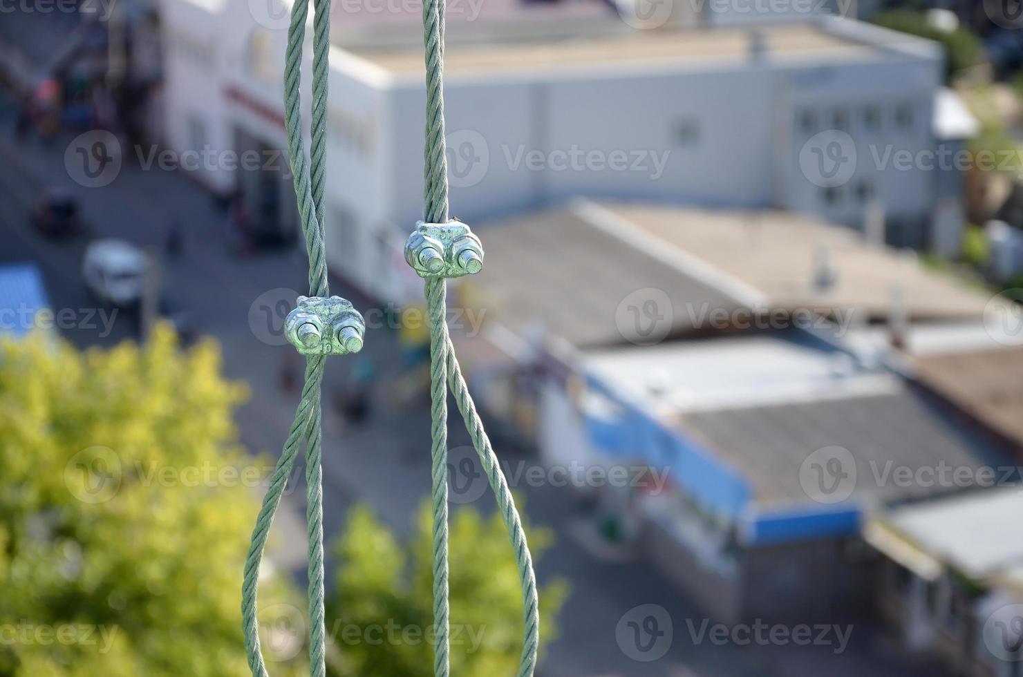 Rope lockers in of suspended wire rope platform for facade works on high multistorey buildings. Rope lockers blocks kink for safety platform usage photo