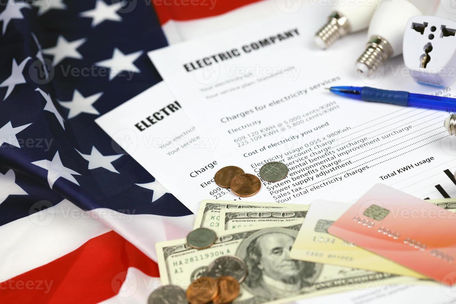 Abstract American electricity bill. Concept of saving money by using energy savings led light bulbs and electric bill payment photo