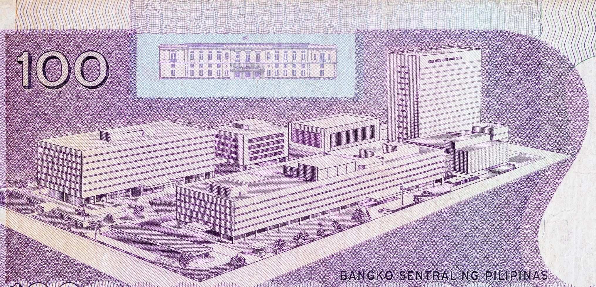 Philippines central bank on 100 piso Philippines money bill close up fragment photo