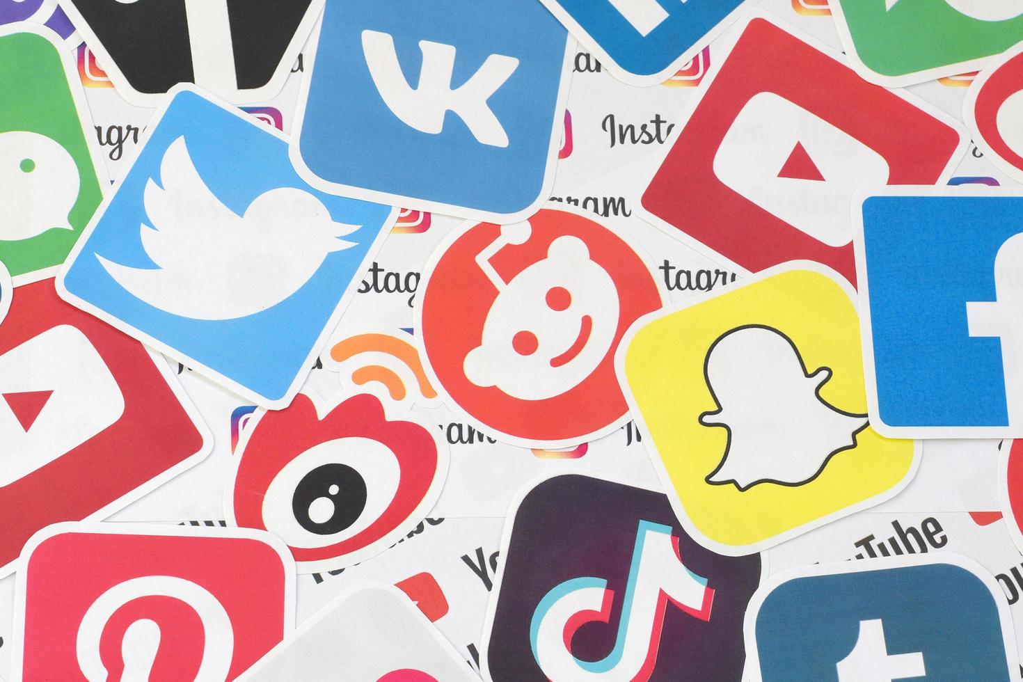 KHARKIV, UKRAINE - MAY 4, 2020 Many paper logos of popular social networks and internet resources. Colorful banner photo