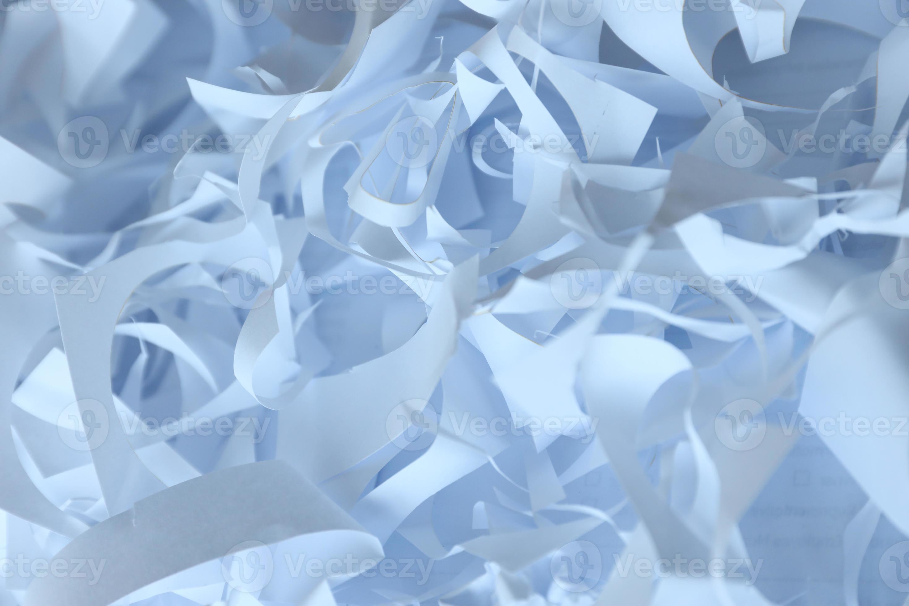 Shredded paper texture background, top view of many white paper strips