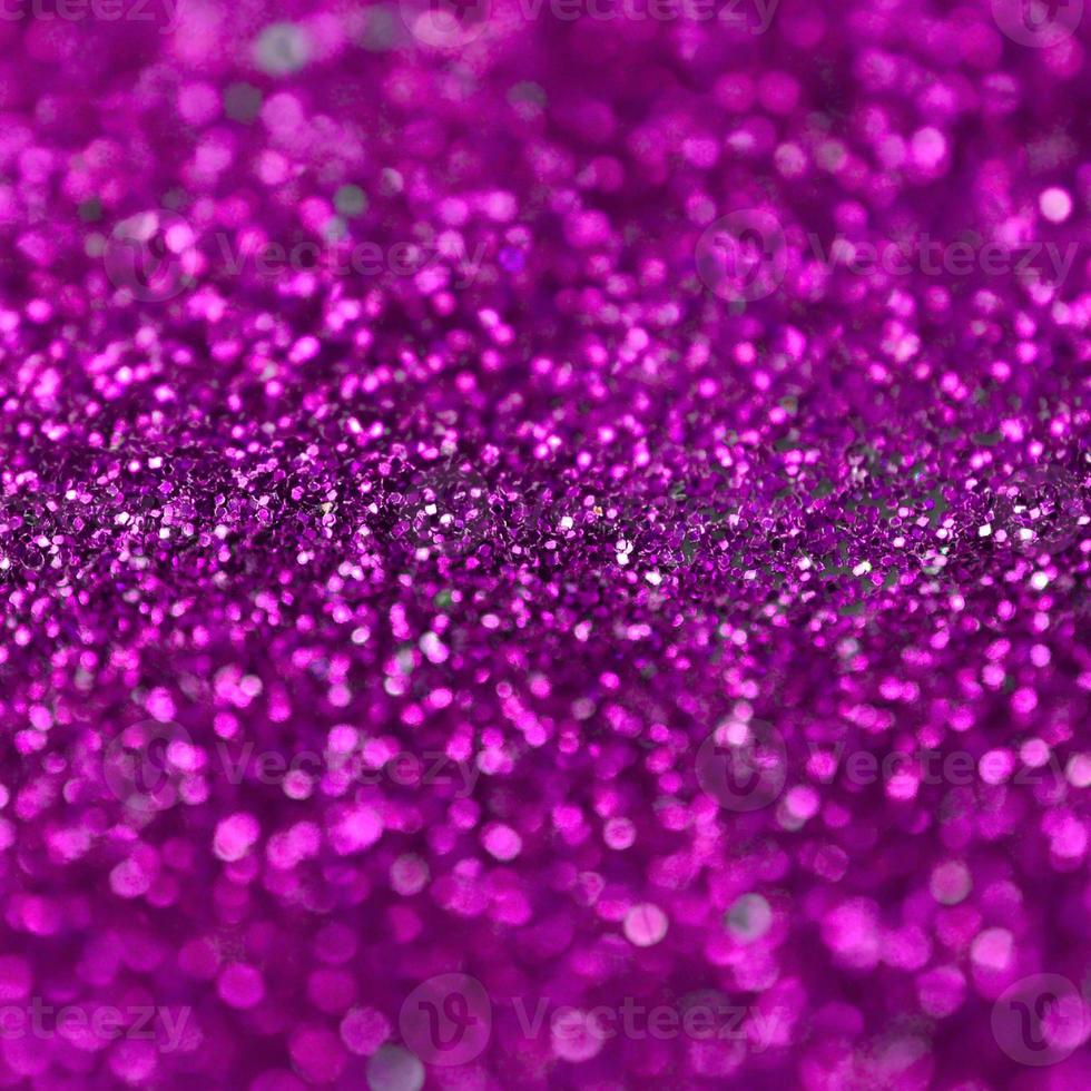 Pink decorative sequins. Background image with shiny bokeh lights from small elements photo