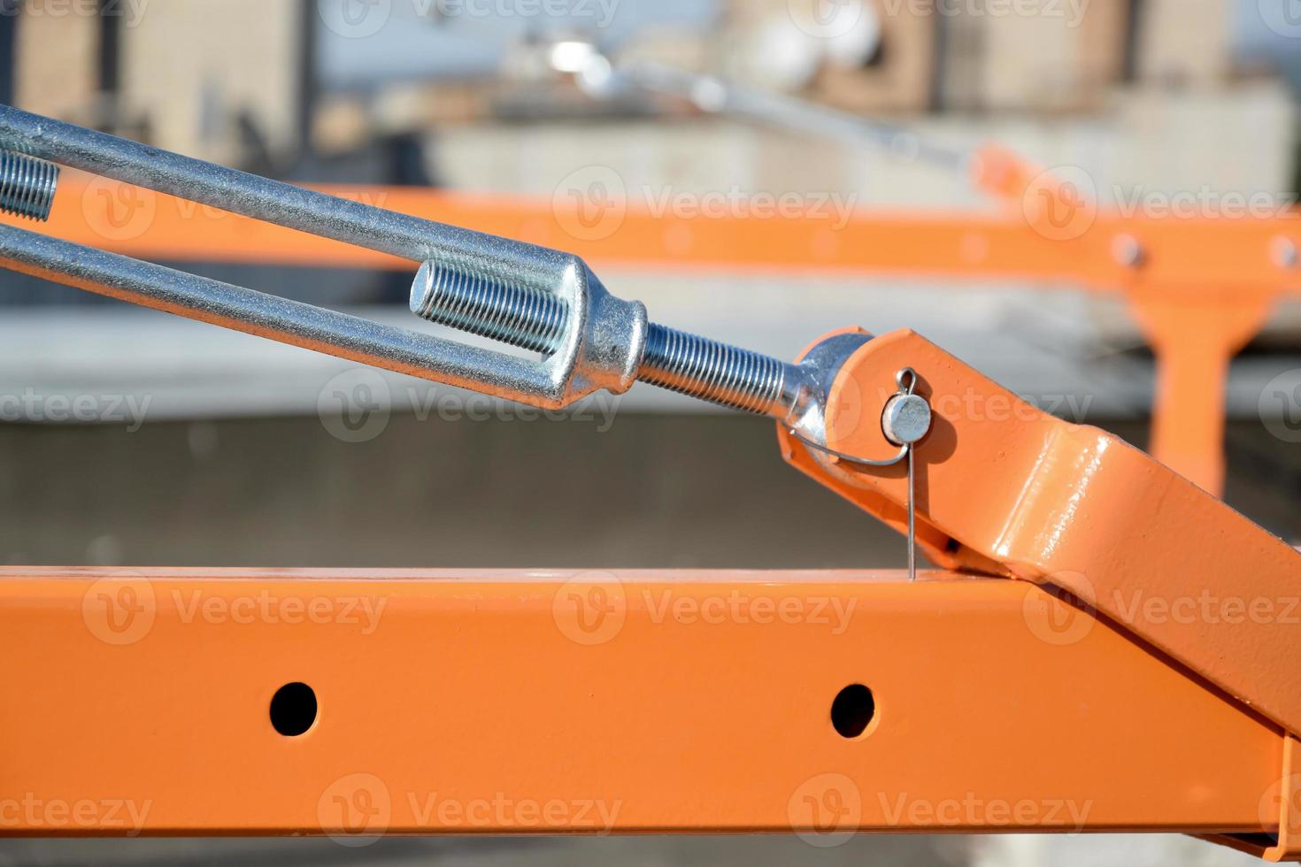 Rope lockers in rear beam of suspended wire rope platform for facade works on high multistorey buildings. Rope lockers blocks kink for safety platform usage photo