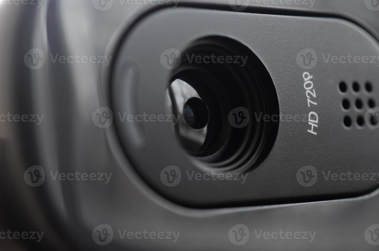 A modern web camera is installed on the body of a flat screen monitor. Device for video communication and recording of high quality video photo