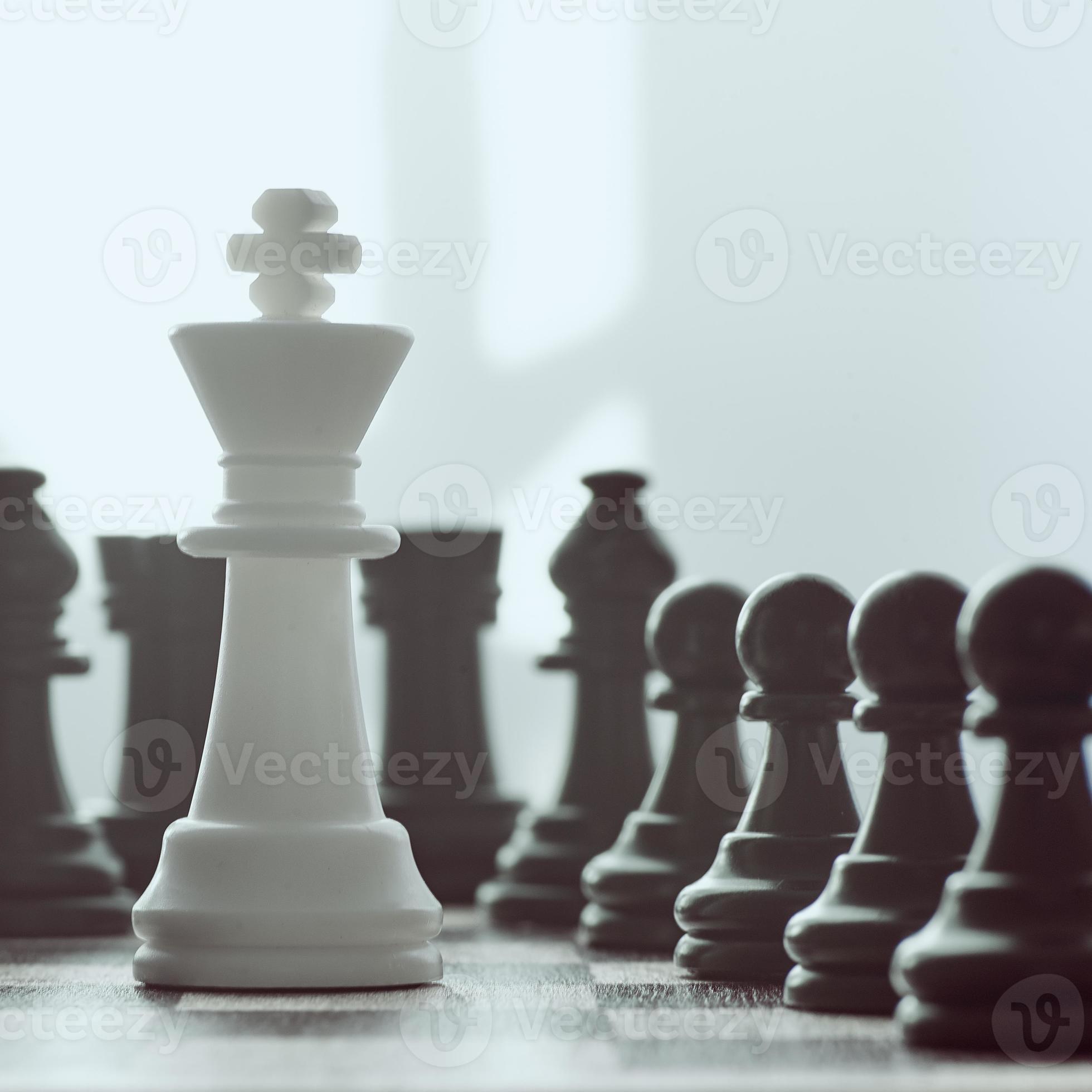 Single white king against many enemies as a symbol of difficult unequal