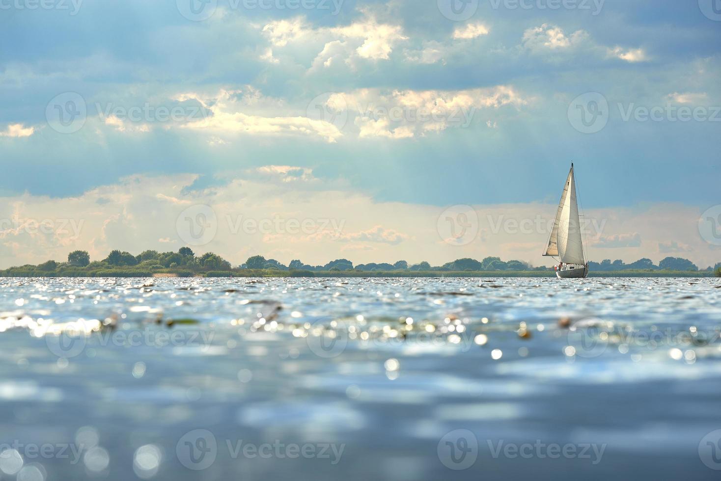 Sailing. Ship yachts with sails on the river. photo