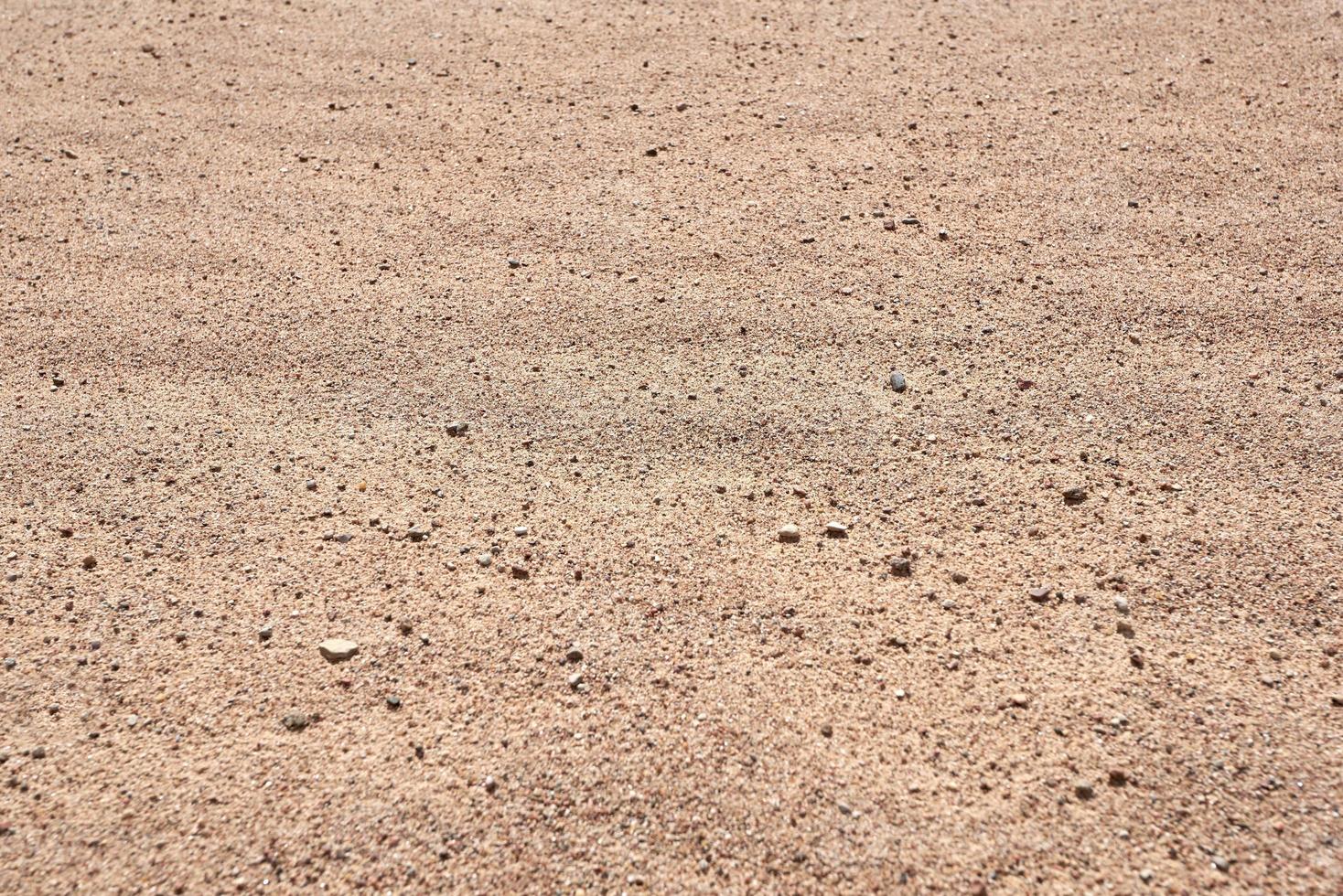 The texture of the sand. The background of beige sand. photo