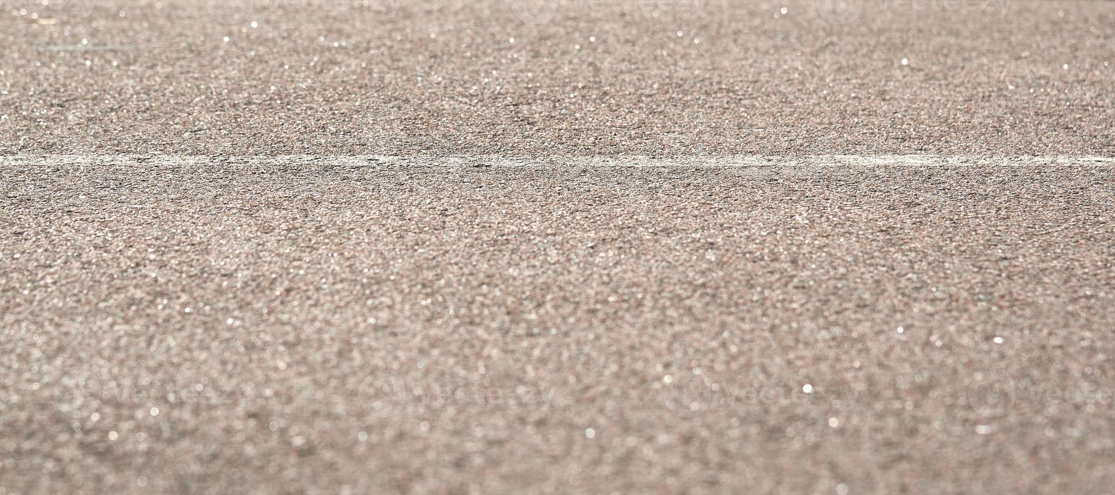 Texture of road asphalt with markup. The foreground in the blur. photo