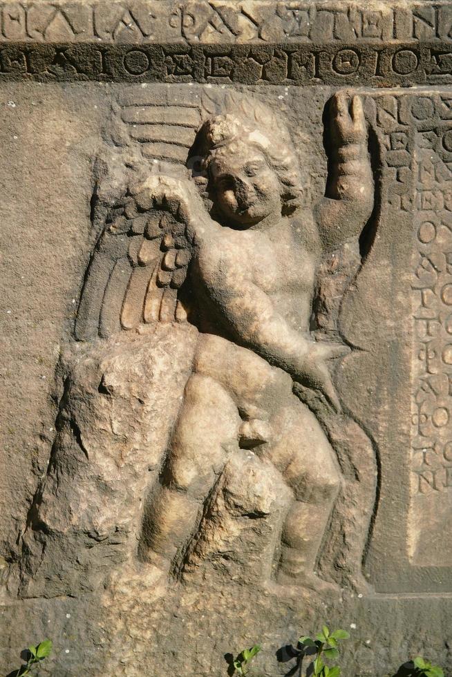 Relief on a Sarcophagus in Aphrodisias Ancient City in Aydin, Turkiye photo