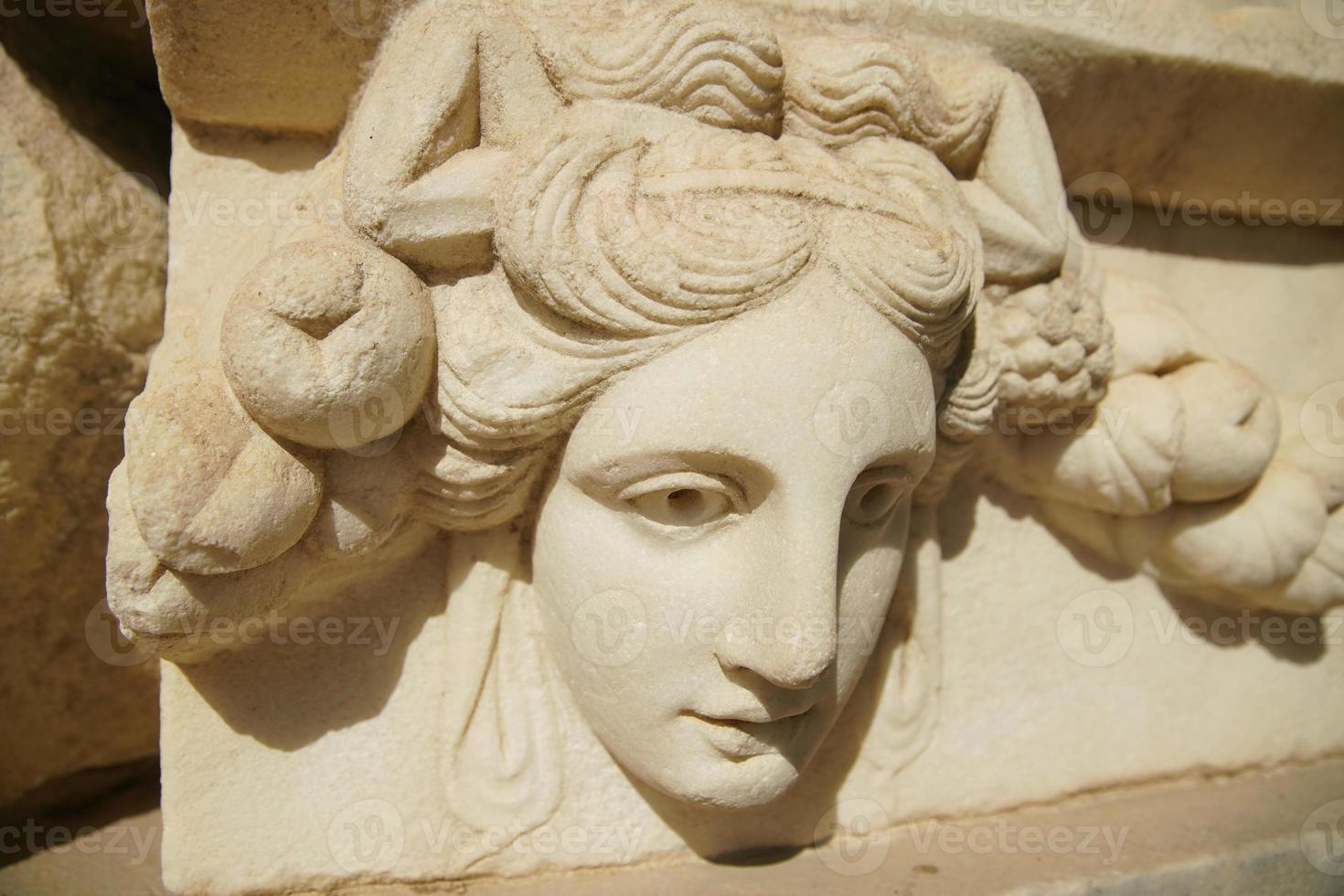 Ancient Mask Relief in Aphrodisias Ancient City in Aydin, Turkiye photo