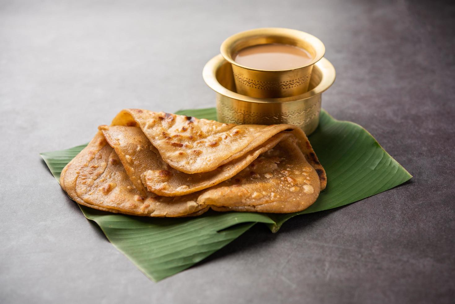 Chai Paratha - Hot Tea served with Flatbread is a traditional simple meal from India and Pakistan photo