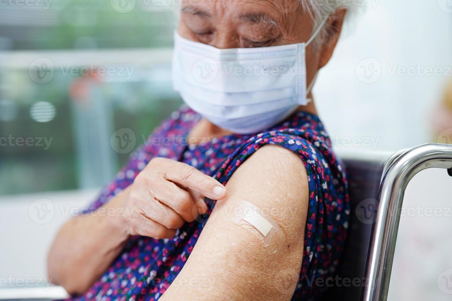 Asian elder senior woman getting vaccine for protect corona virus. photo