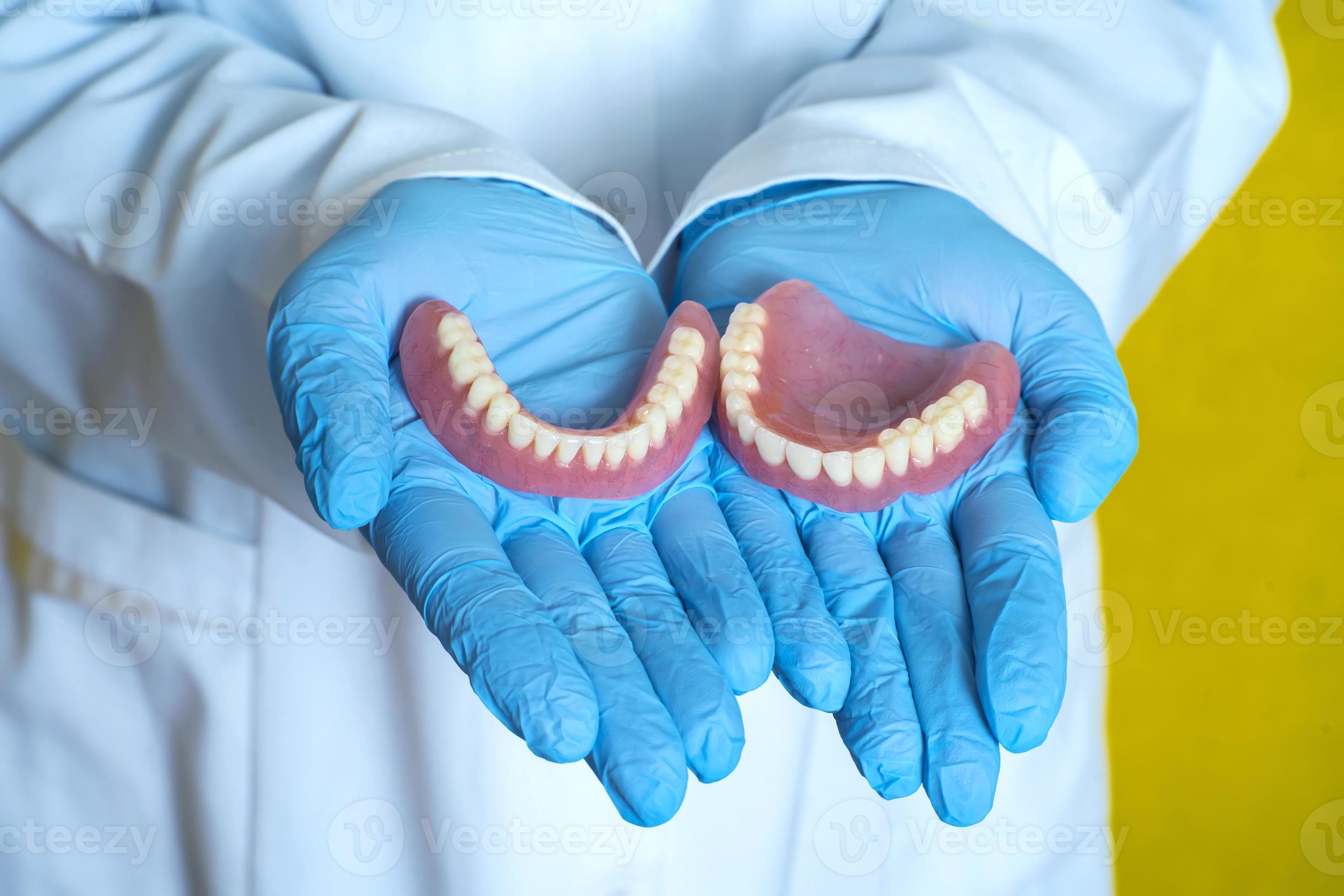 dentures in the hands of a dental technician 13262563 Stock Photo at