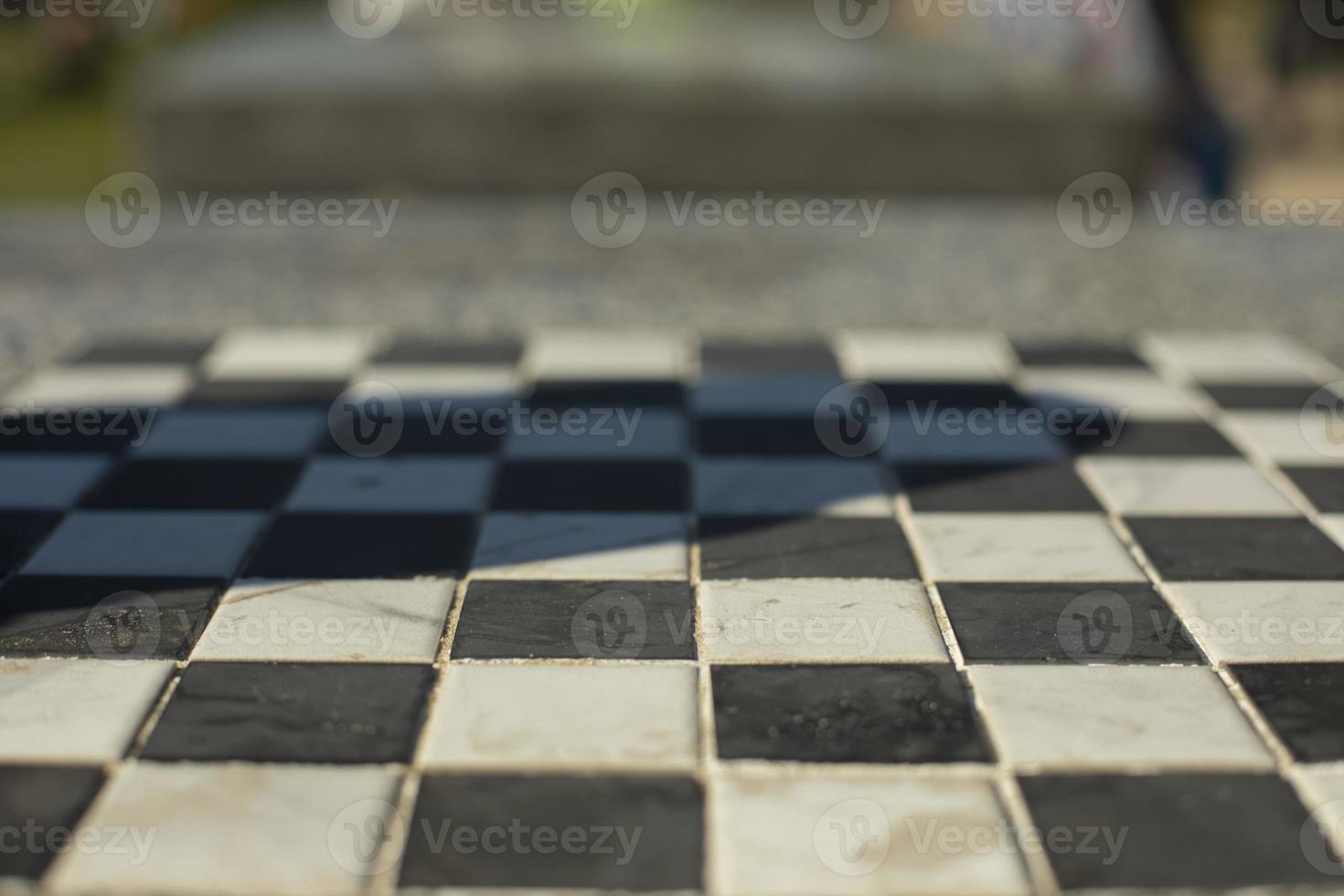 Chessboard in table. Black and white cells. Playing field. photo