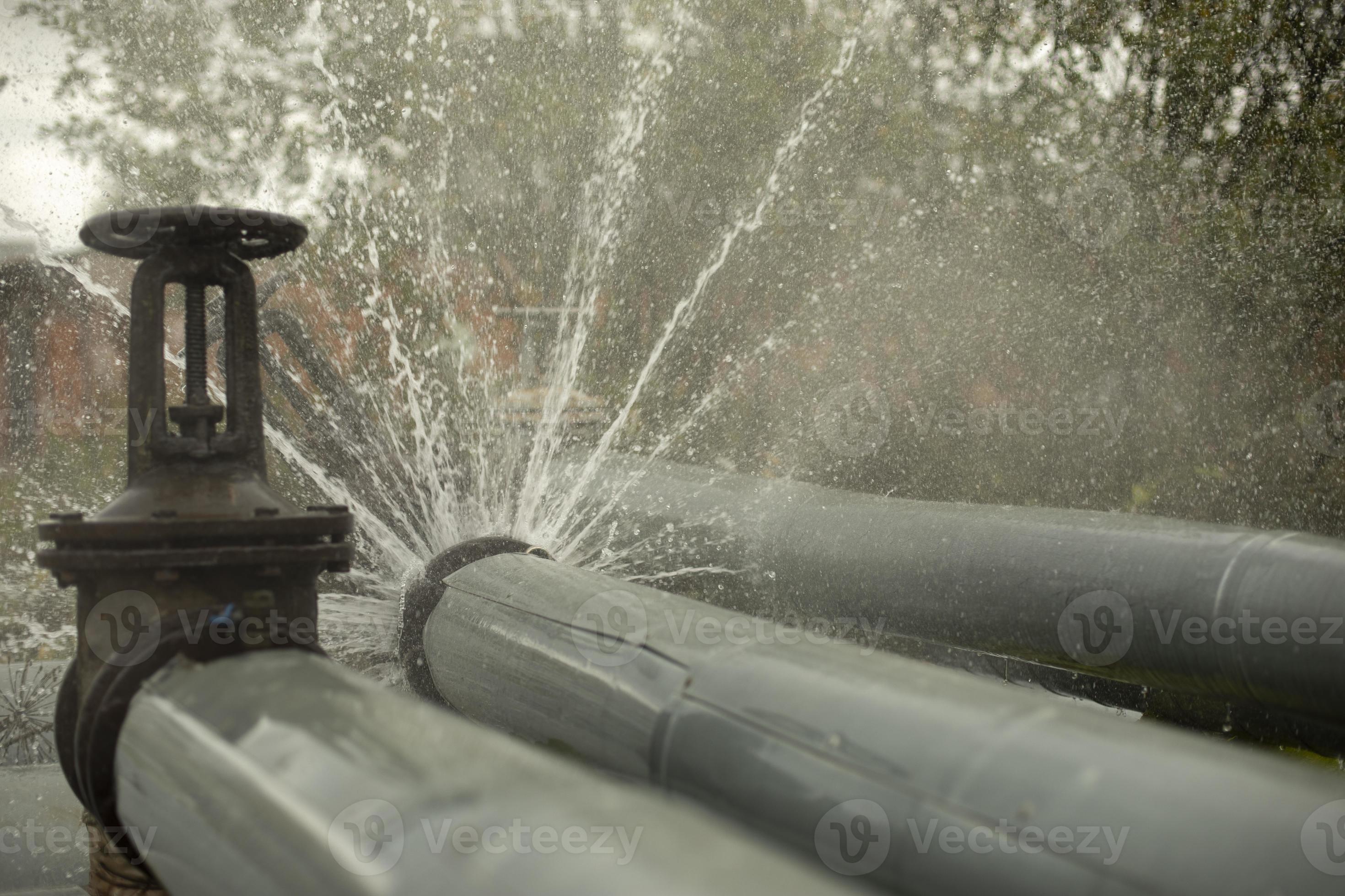 Breakthrough heating pipe. Pipeline accident. Boiling water pours out