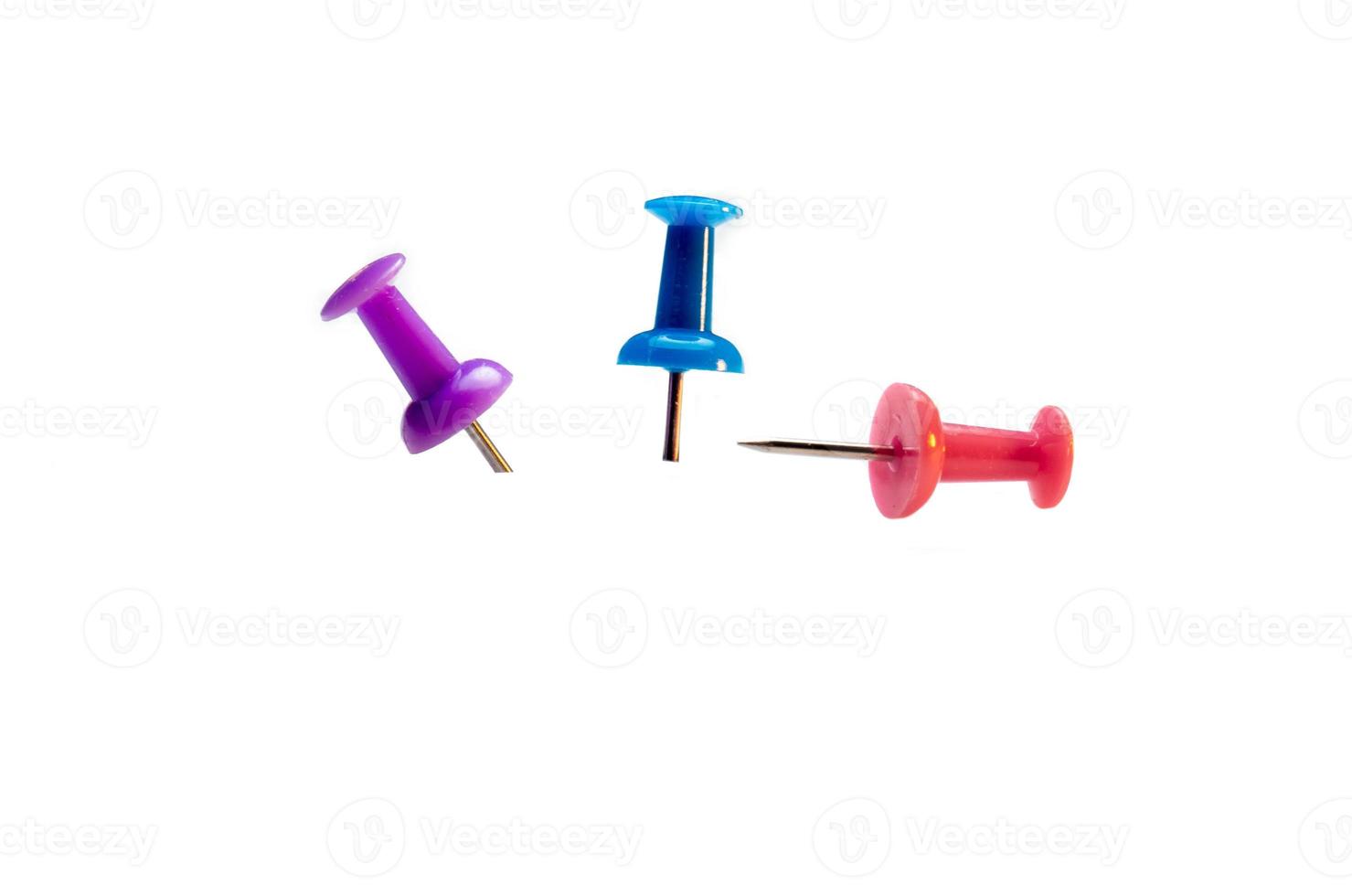 colored memothumb tacks. Stationery on white background photo