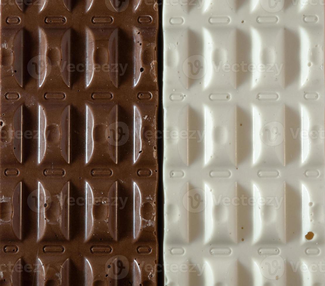 Dark and white chocolate. Chocolate background. Contrast of chocolate bars photo