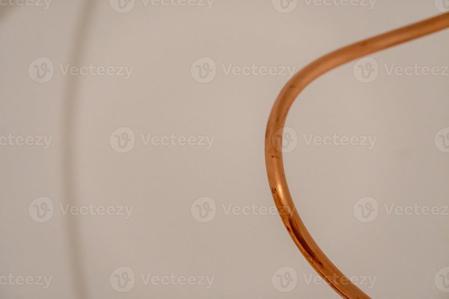 copper profiles of different dimensions on white background, polished copper reflecting light photo