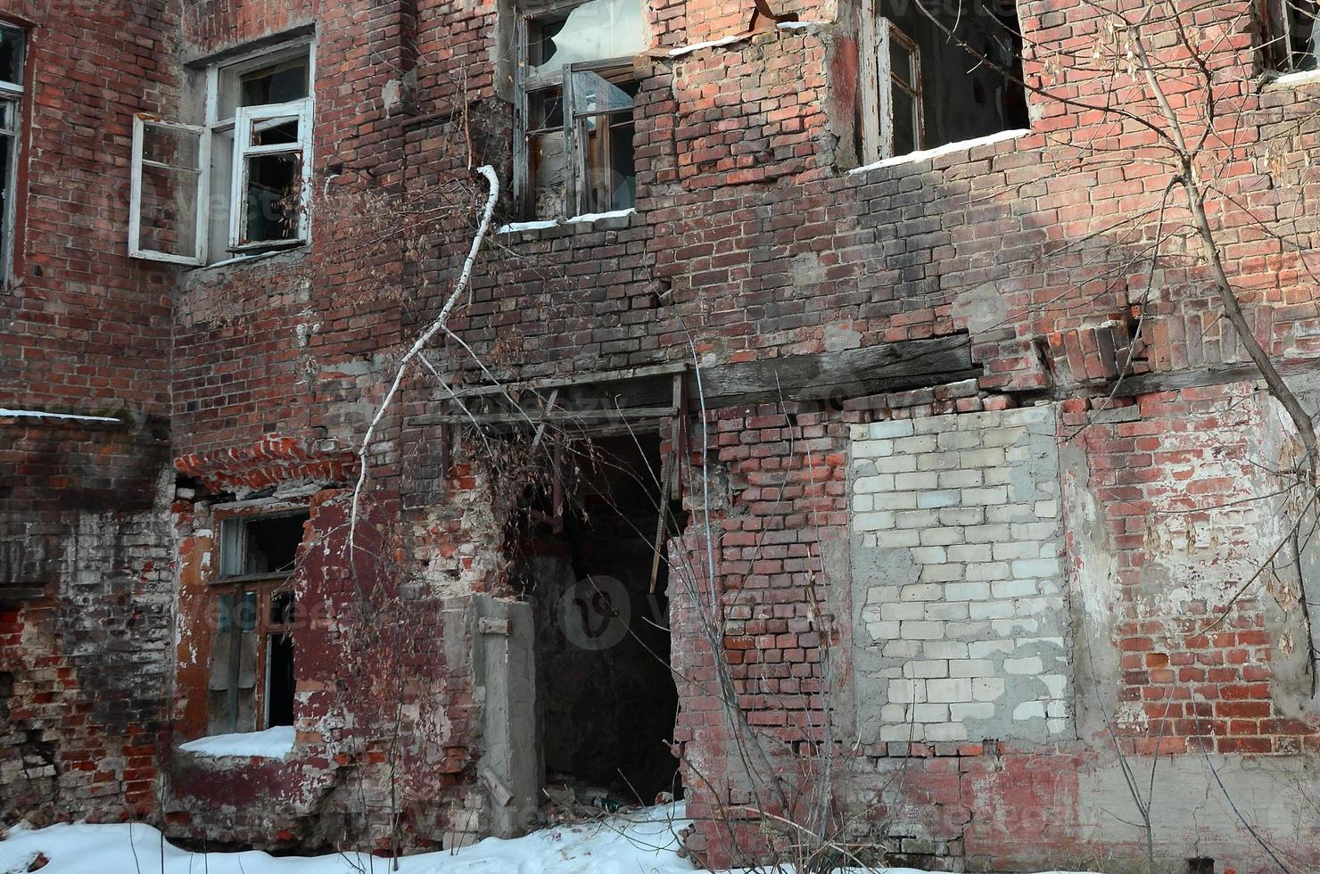 Fragment of an abandoned two-story building after military operations in Donetsk photo