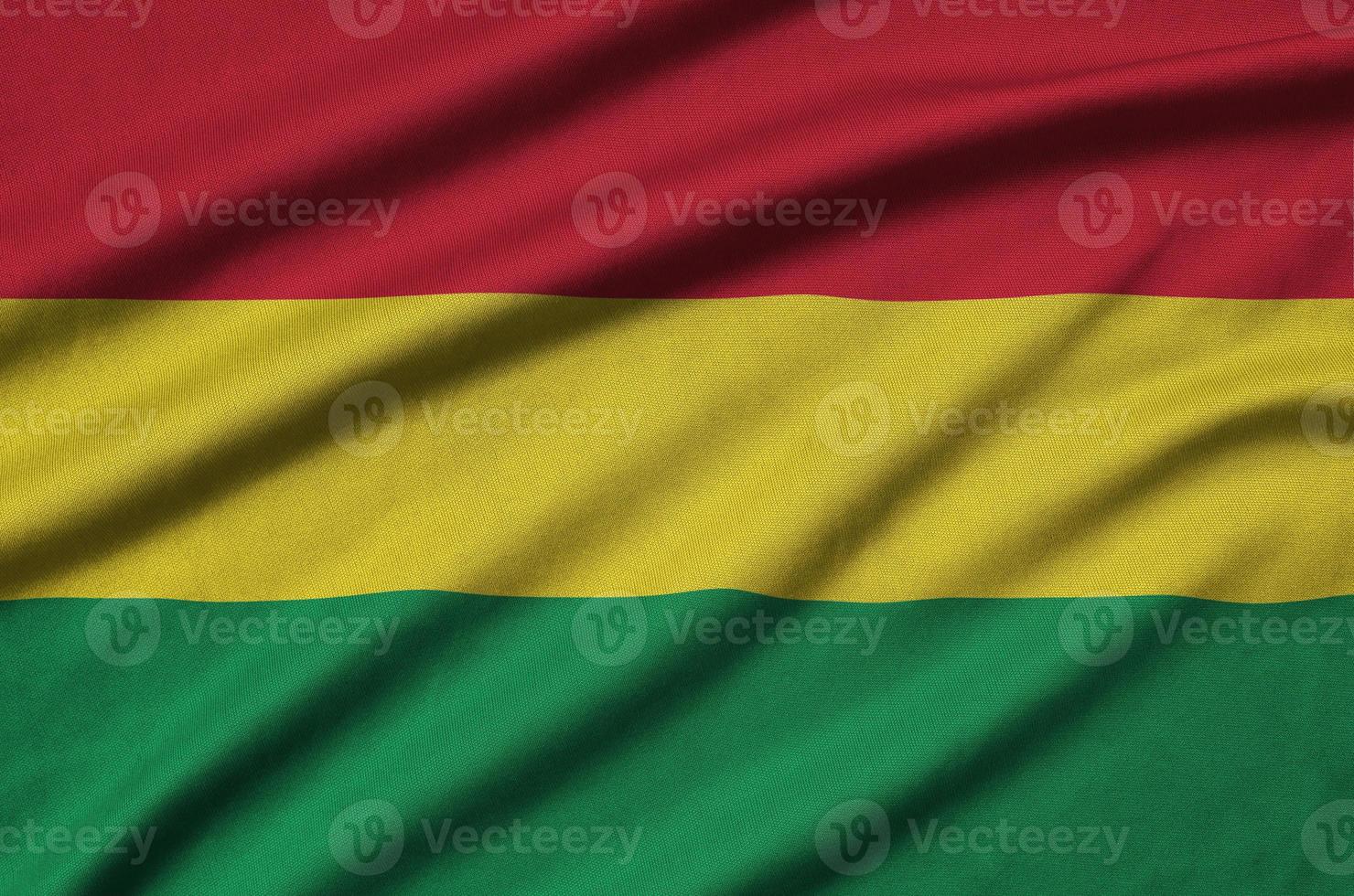 Bolivia flag  is depicted on a sports cloth fabric with many folds. Sport team banner photo