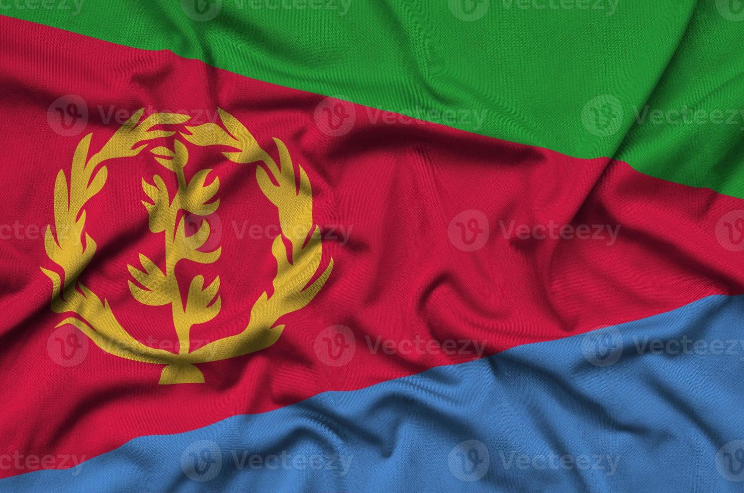 Eritrea flag  is depicted on a sports cloth fabric with many folds. Sport team banner photo