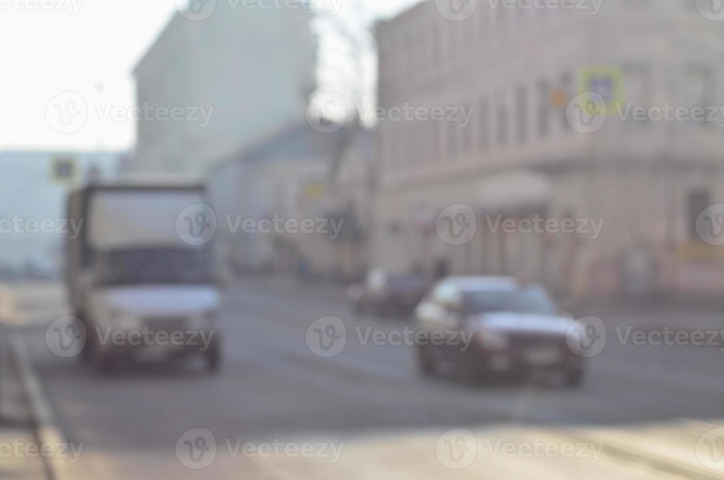 Blurred landscape of highway with cars in foggy morning photo