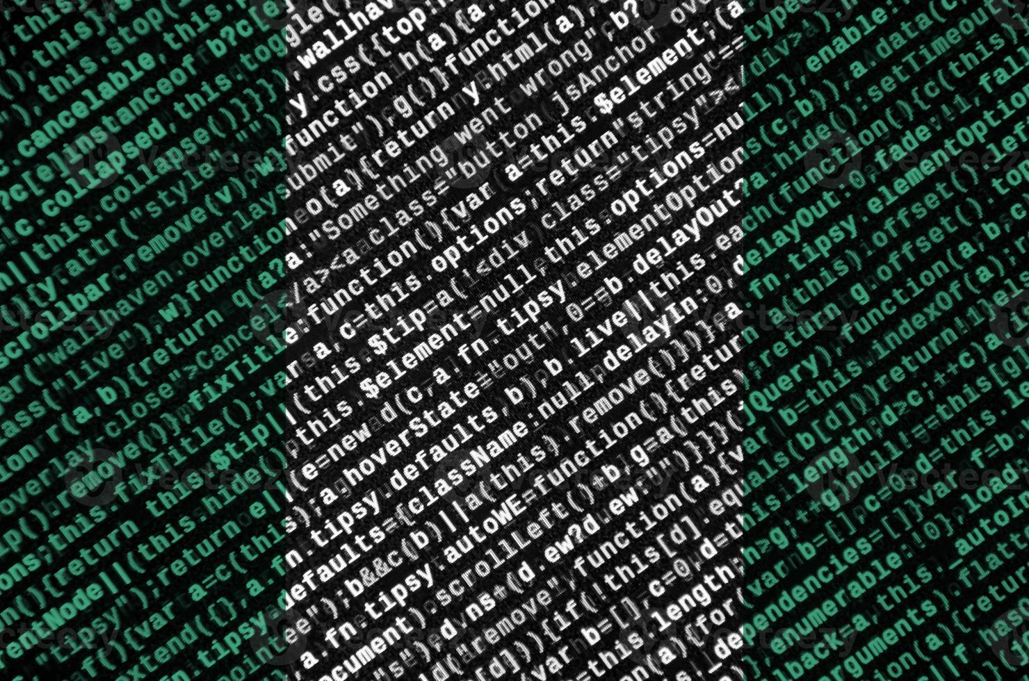 Nigeria flag  is depicted on the screen with the program code. The concept of modern technology and site development photo