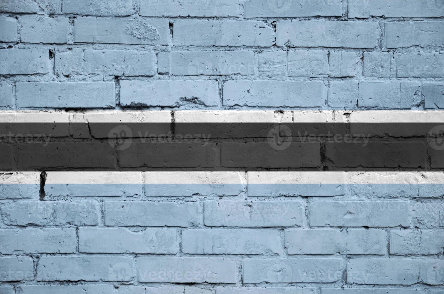 Botswana flag is painted onto an old brick wall photo