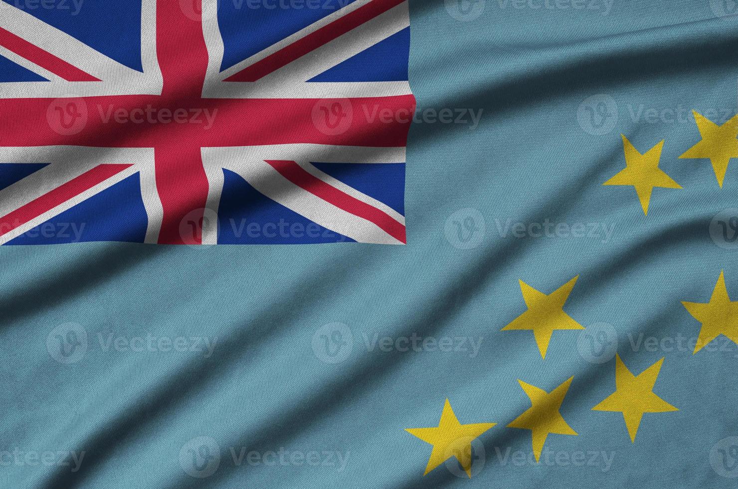 Tuvalu flag  is depicted on a sports cloth fabric with many folds. Sport team banner photo