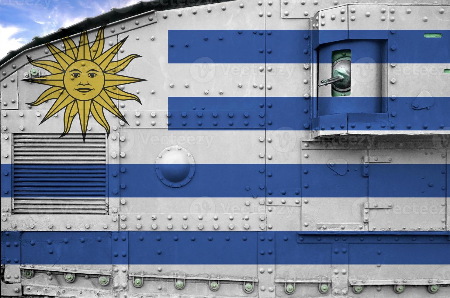 Uruguay flag depicted on side part of military armored tank closeup. Army forces conceptual background photo
