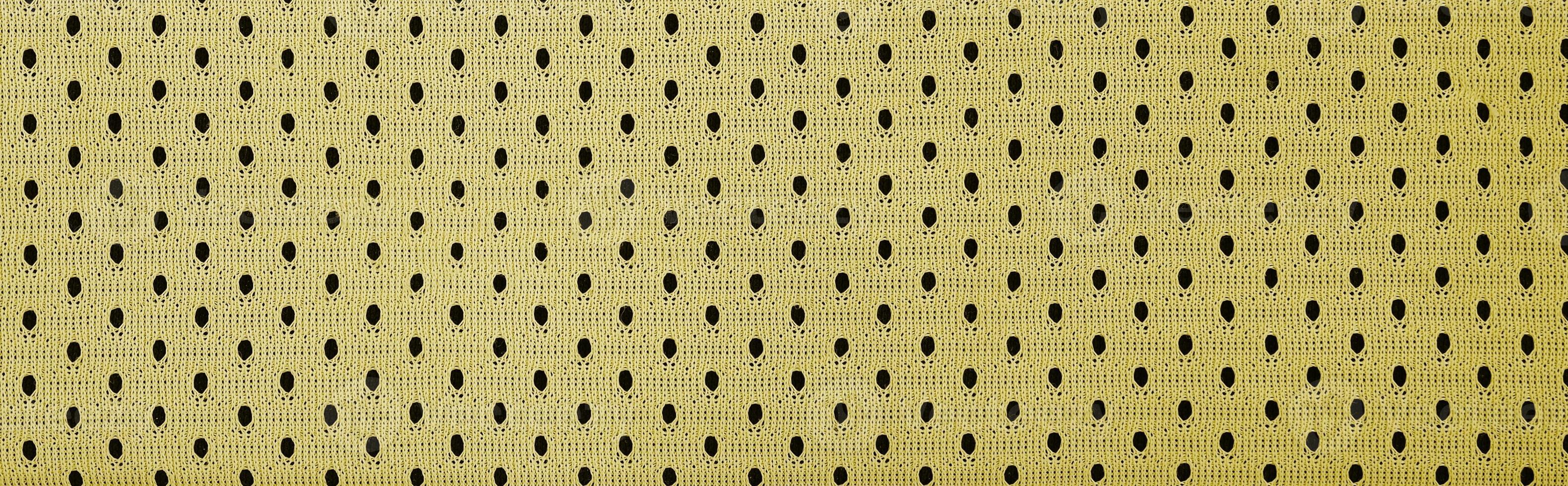 Yellow mesh sport wear fabric textile background pattern photo