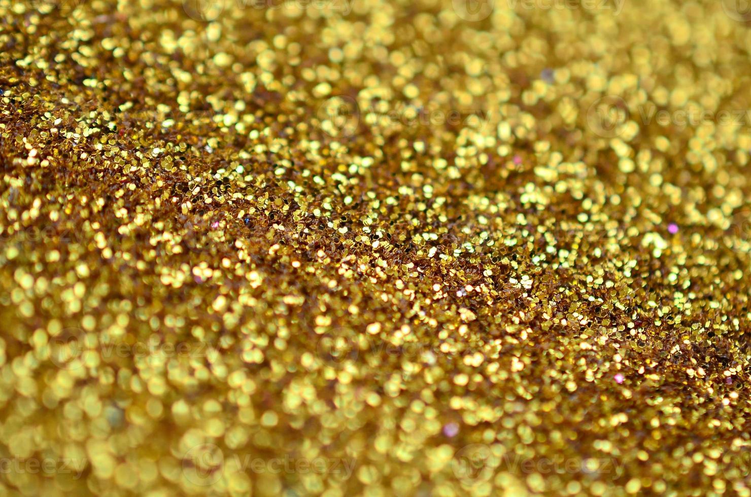 Orange decorative sequins. Background image with shiny bokeh lights from small elements photo