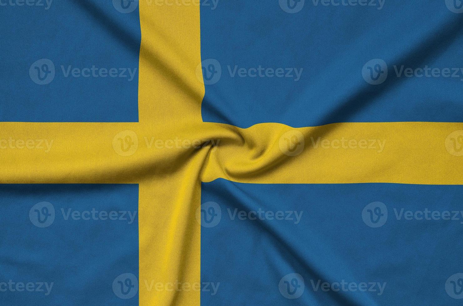 Sweden flag  is depicted on a sports cloth fabric with many folds. Sport team banner photo